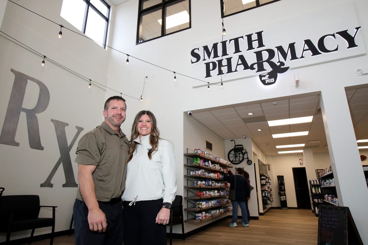 The owners inside Smith Pharmacy
